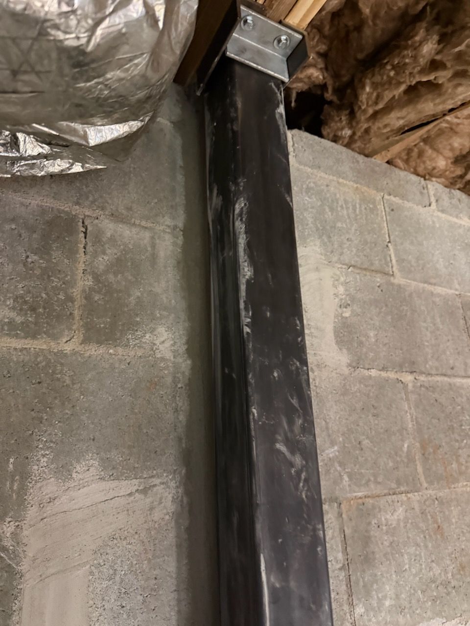 Close-up of upper carbon-fiber reinforcement connection at the floor framing