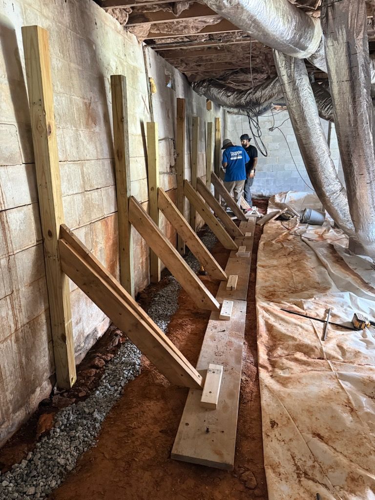 Foundation Worx temporary bracing supporting a basement block wall during repair