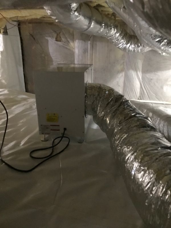 Crawl space dehumidifier with flexible ducting inside an encapsulated crawl space